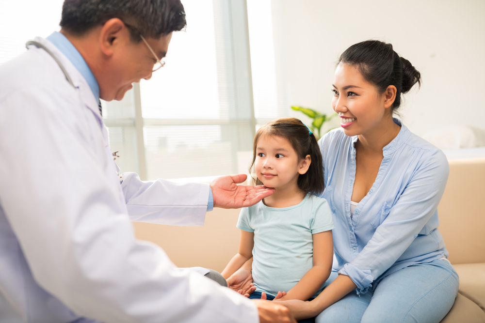 little girl with her mother for a check-up