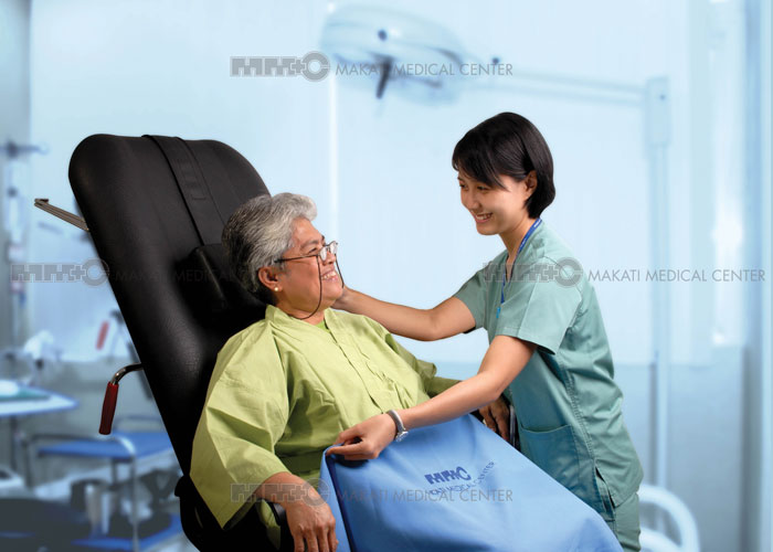 hospital staff assisting an elderly