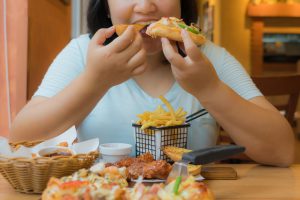 woman eating high-carb foods