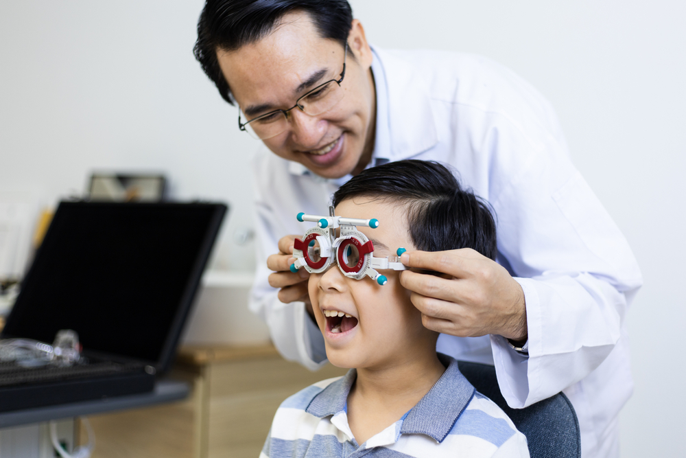 ophthalmologist examines eyesight of the child