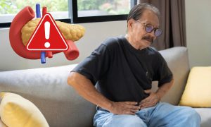 old man with his hands on his stomach